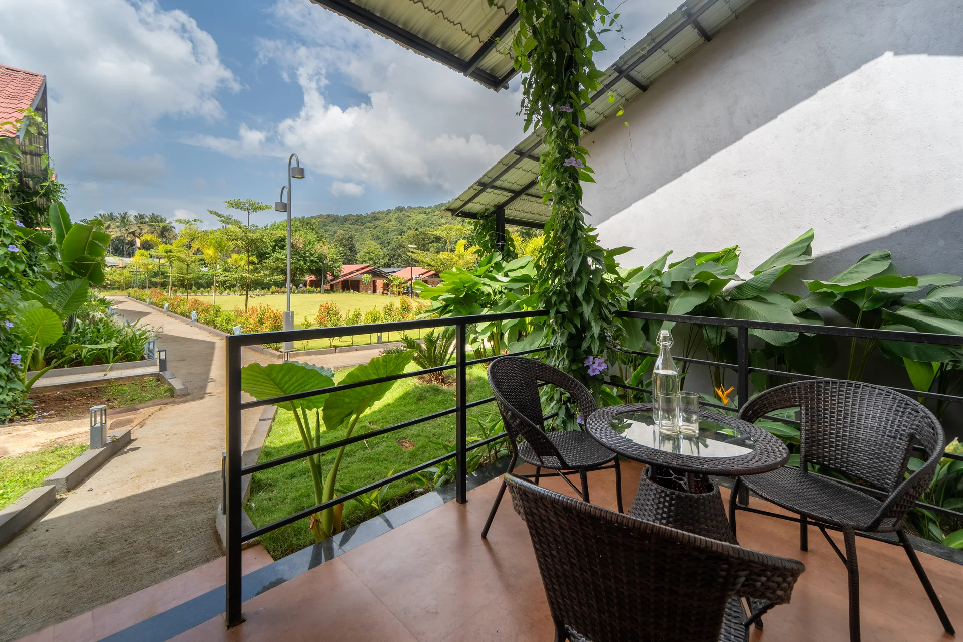Deluxe Cottage balcony and garden view at Nadi Teera, Dandeli