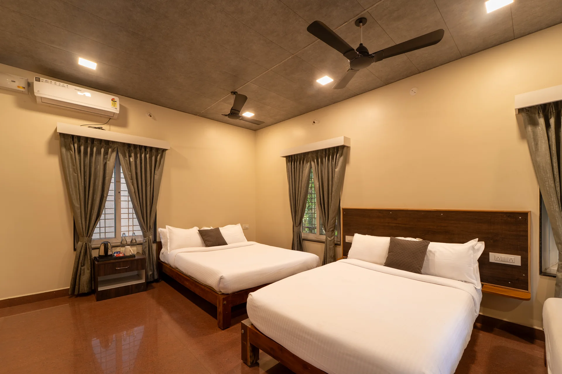 Deluxe Cottage air-conditioned bedroom at Nadi Teera, Dandeli