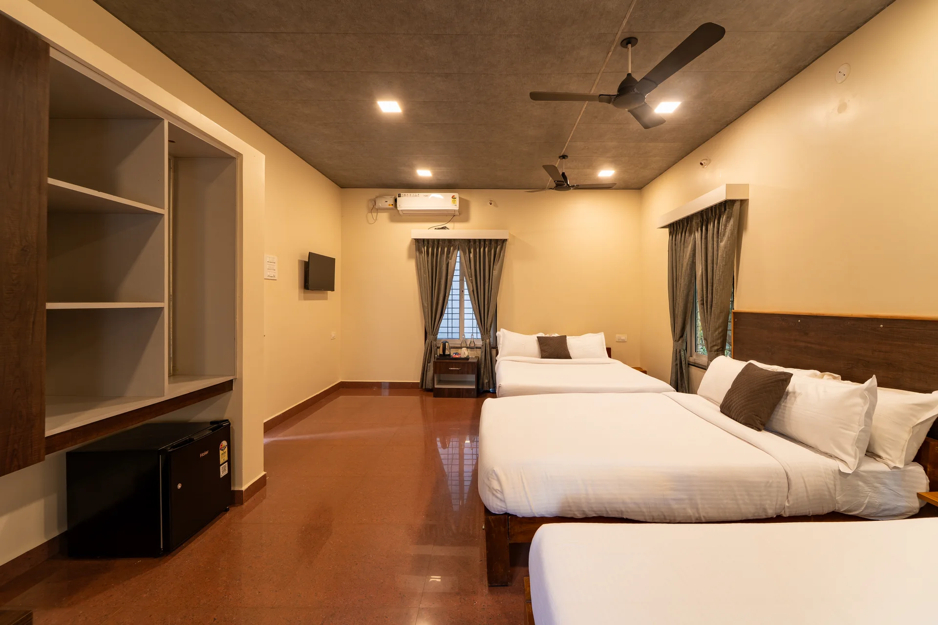 A wide view of the Deluxe Cottage room at Nadi Teera, Dandeli