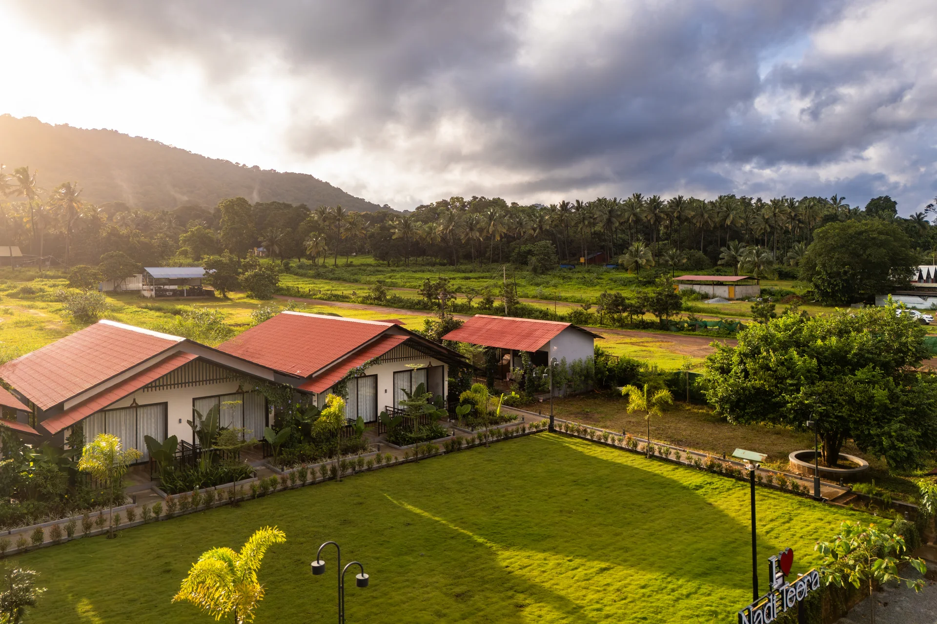 Aerial view of the garden and cottages at Nadi Teera, Dandeli