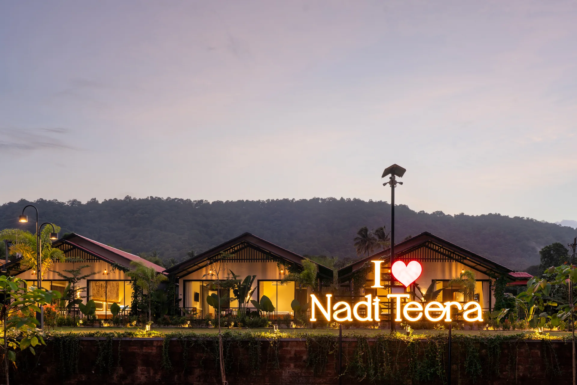 The Nadi Teera sign at dusk at Nadi Teera, Dandeli