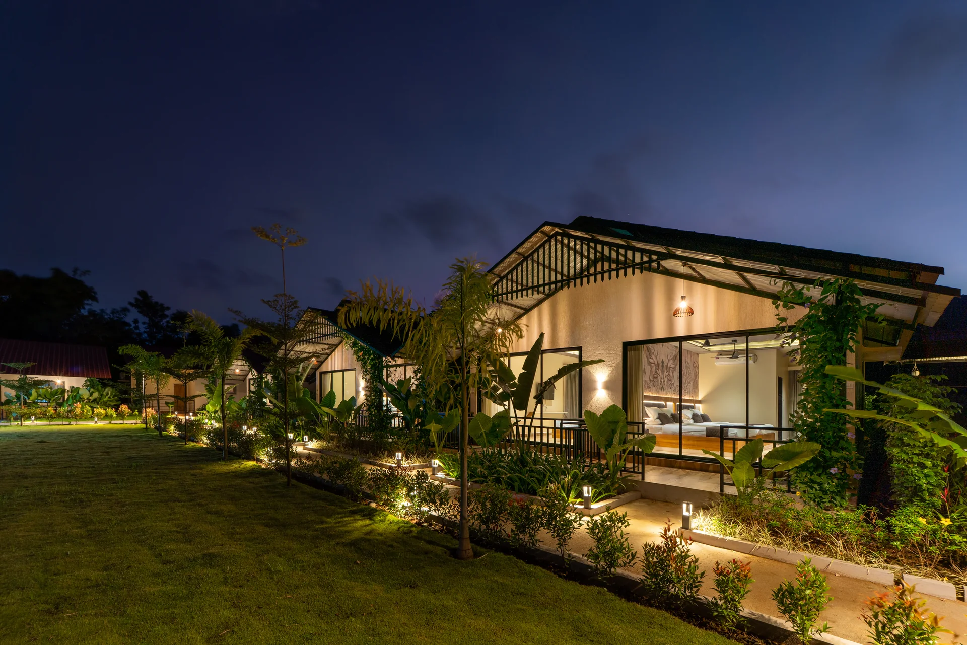 A glowing cottage veranda at Nadi Teera, Dandeli