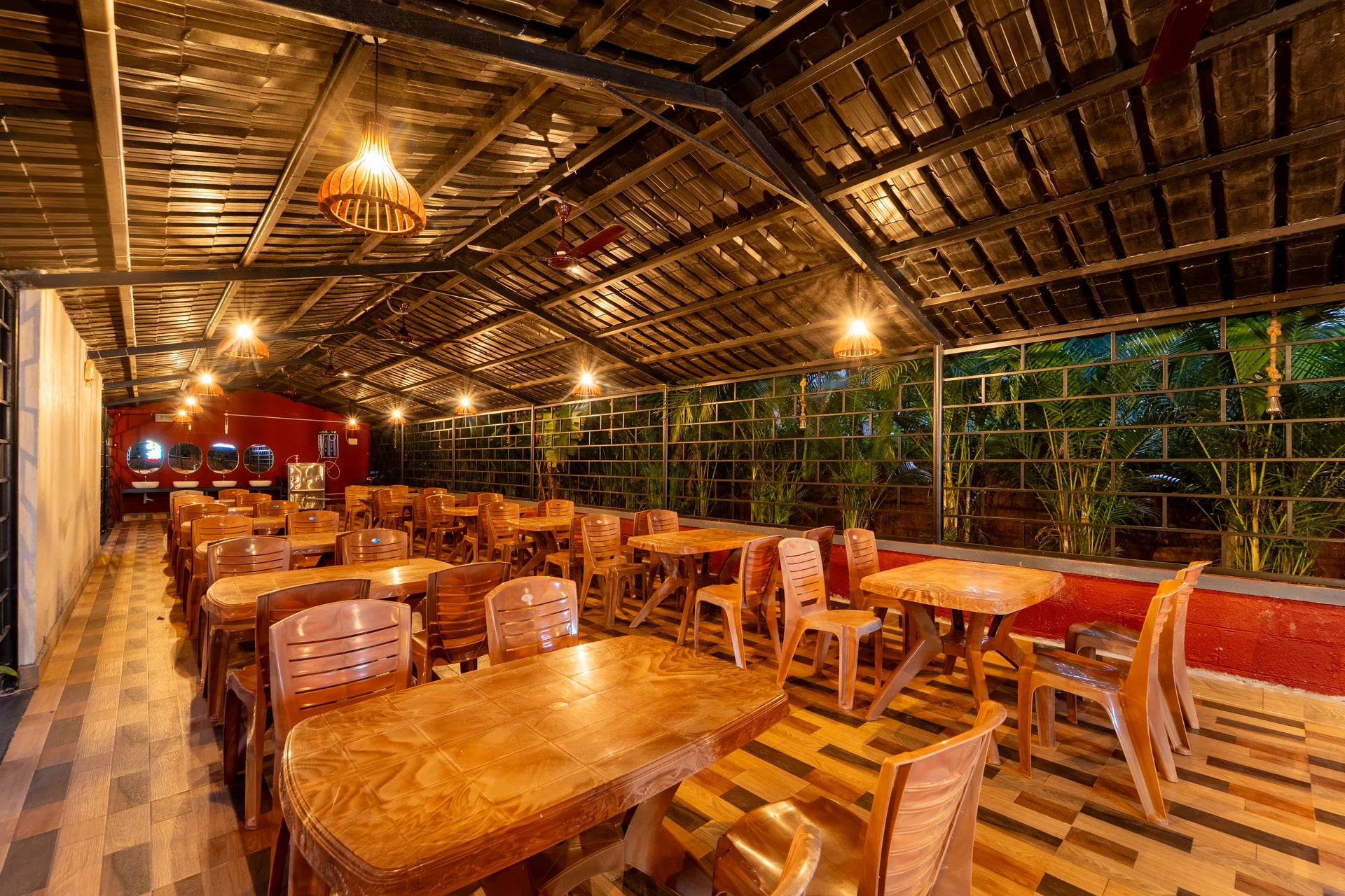 Warm lights in the dining hall at Nadi Teera, Dandeli