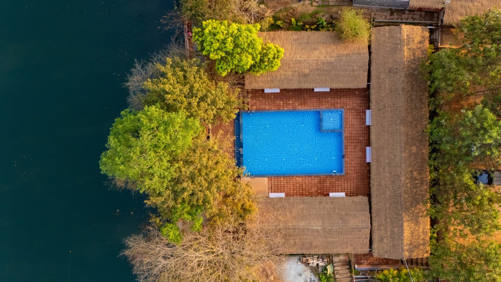 Aerial pool and river view at Nadi Teera Dandeli