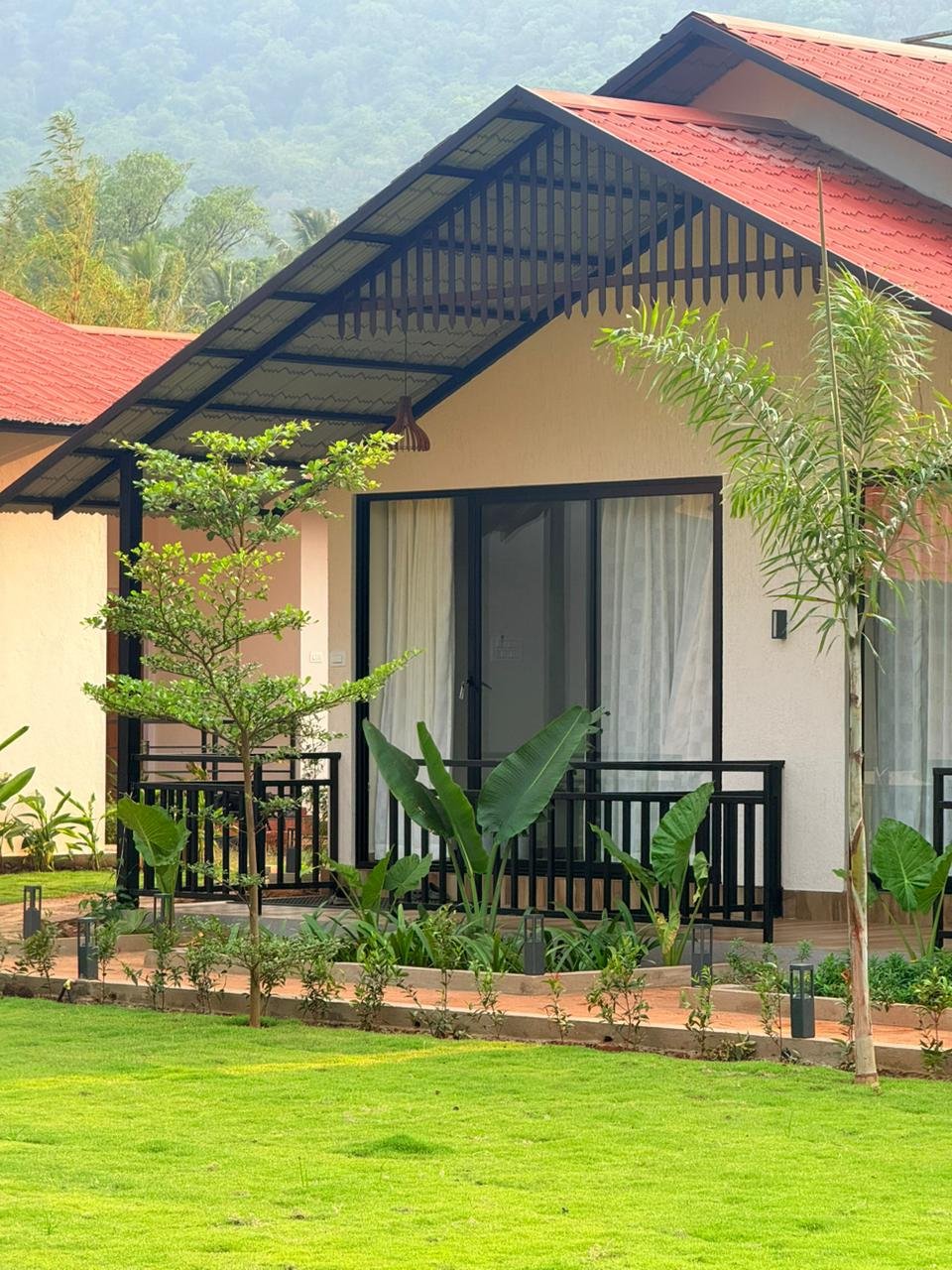 Deluxe Cottage exterior with hills